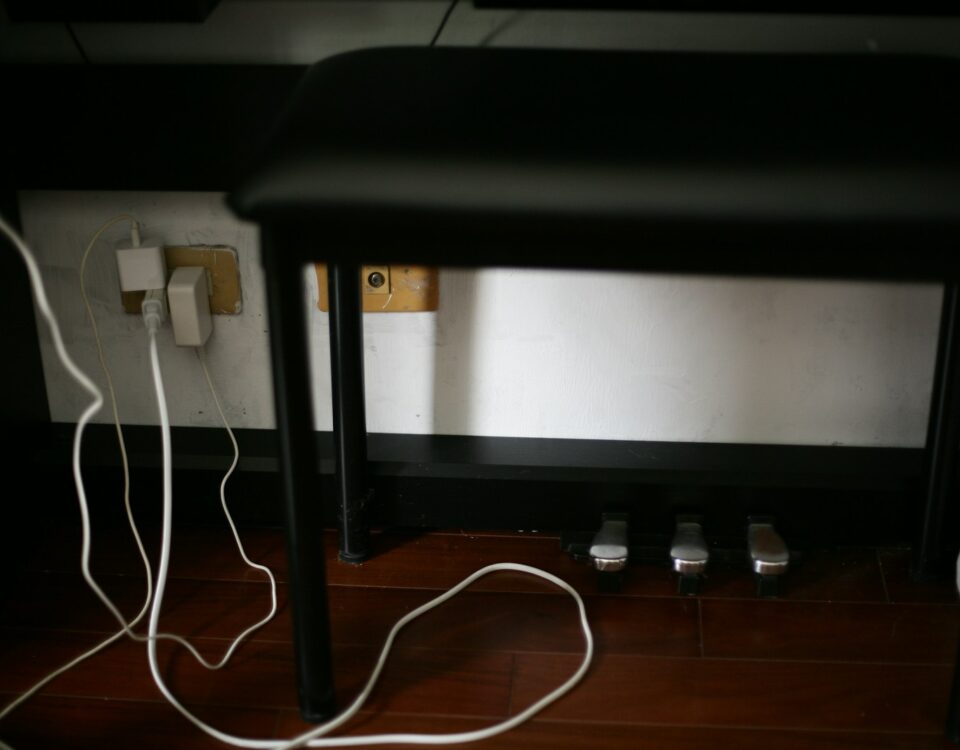 black and white electric wires on brown wooden floor